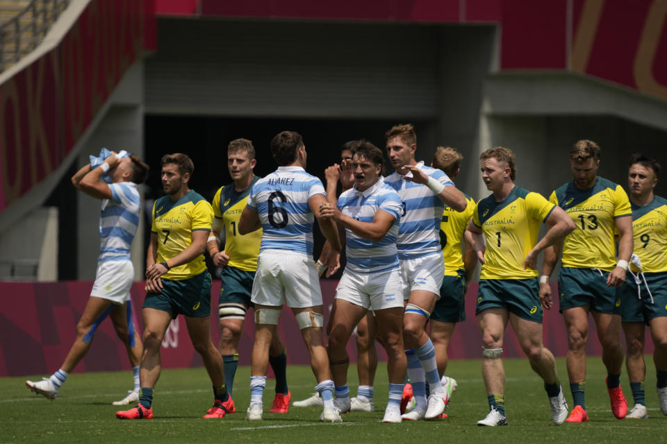 Argentina players, center, celebrate after defeating Australia in their men's rugby sevens match at the 2020 Summer Olympics, Monday, July 26, 2021 in Tokyo, Japan. (AP Photo/Shuji Kajiyama)