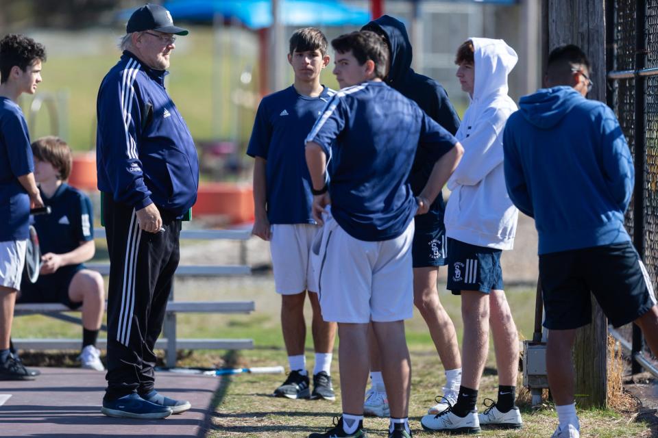 Somerset Berkley Regional boys tennis coach Doug Chapman, left, talks to his team during their match with Case on Tuesday. Somerset Berkley bested Case, making it the 700th career win for Chapman.