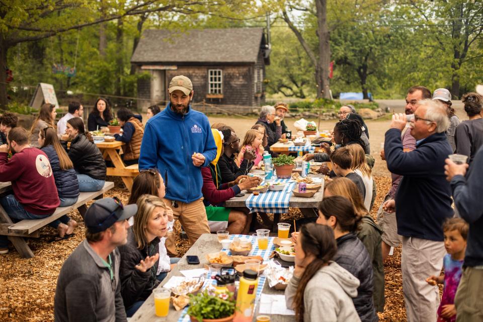 A crowd enjoying food at Vernon Kitchen at a soft opening at Vernon Family Farm, 301 Piscassic Road in Newfields.