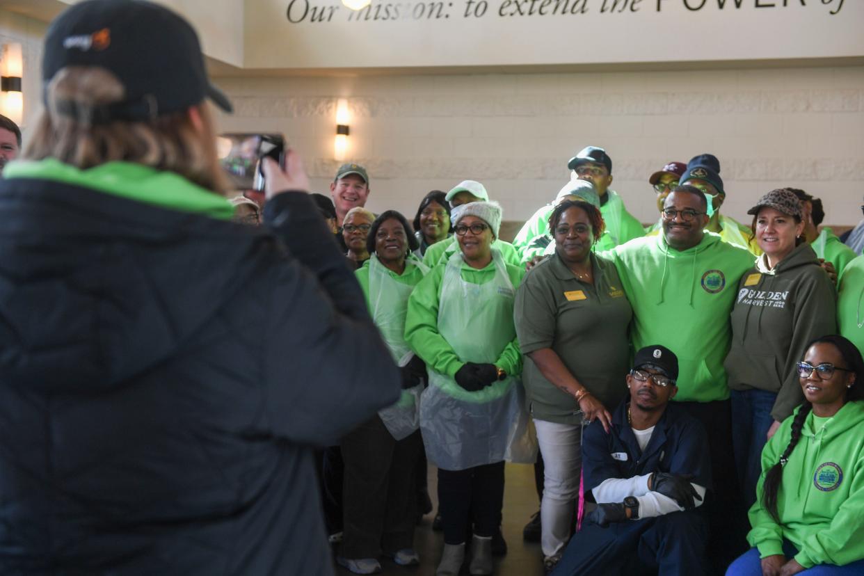 August Mayor Garnett Johnson (center) takes a photo with volunteers during the second annual MLK Day of Service at The Master's Table on Monday, Jan. 15, 2024. Golden Harvest Food Bank prepared to serve about 300 lunches, in addition to medical screenings by Augusta University students, and showers through Project Refresh.