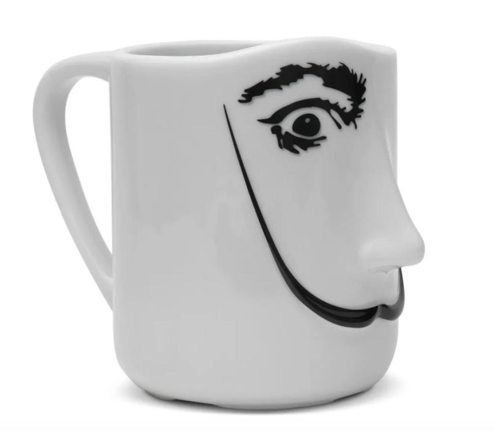 What a smug mug &mdash; this one has the face of Salvador Dal&iacute;, with his well-known mustache. It's ideal for the art lover who prefers the strange things in life. <a href="https://fave.co/3oRdXkp" target="_blank" rel="noopener noreferrer">Find it for $25 at the Met Store</a>.