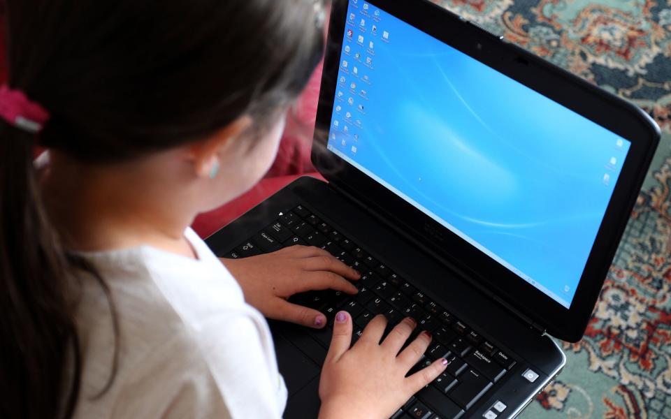 Child using computer - Peter Byrne/PA Wire