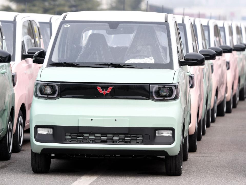New energy vehicles are seen in a parking lot at the Qingdao branch of SAIC-GM-Wuling Automobile Co., LTD in The West Coast New Area of Qingdao, East China's Shandong Province, March 30, 2022.
