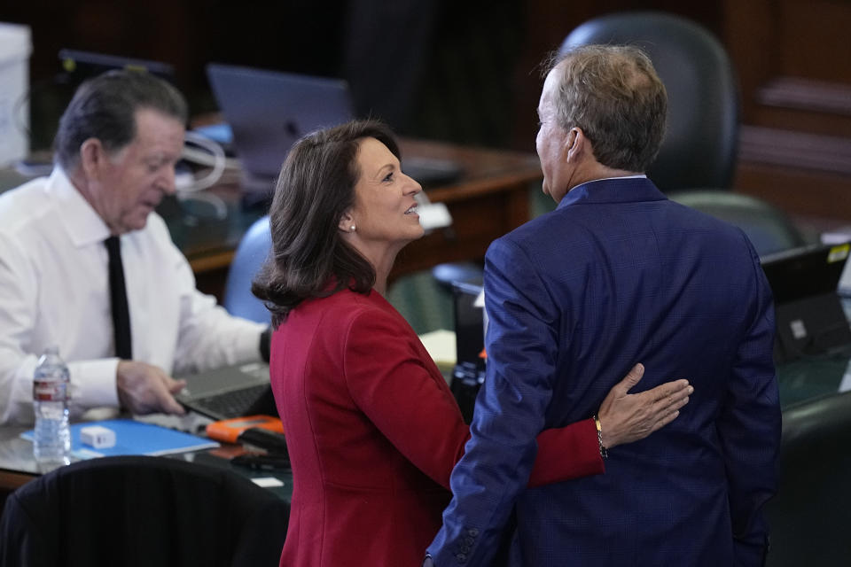 Texas state Attorney General Ken Paxton, right, is hugged by his wife State Sen. Angela Paxton, R-McKinney before the impeachment trial for Texas Attorney General Ken Paxton in the Senate Chamber at the Texas Capitol, Tuesday, Sept. 5, 2023, in Austin, Texas. (AP Photo/Eric Gay)