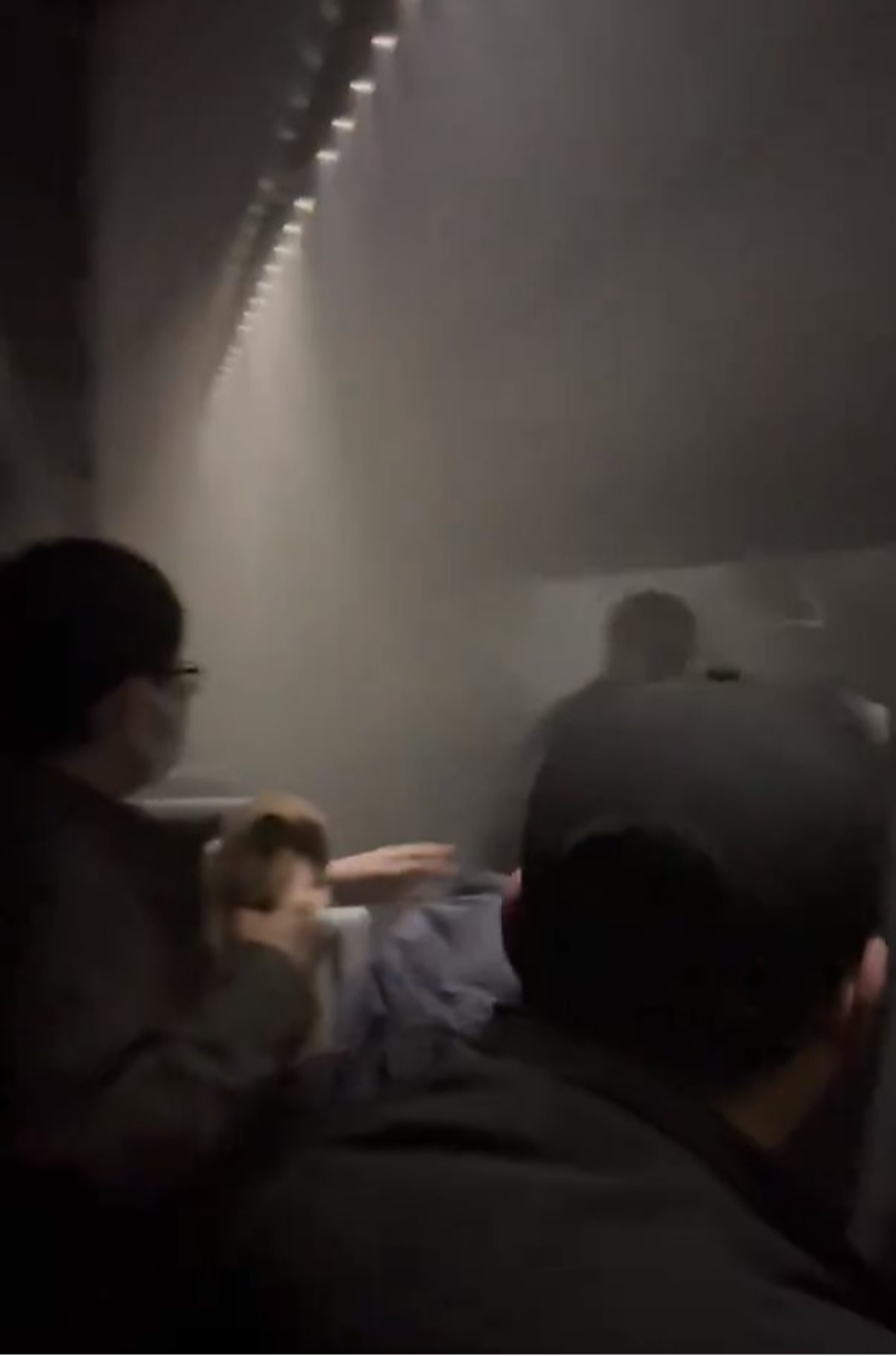 Video taken by a passenger shows inside of the Japan Airlines flight as it was on fire (X / @alto_maple)