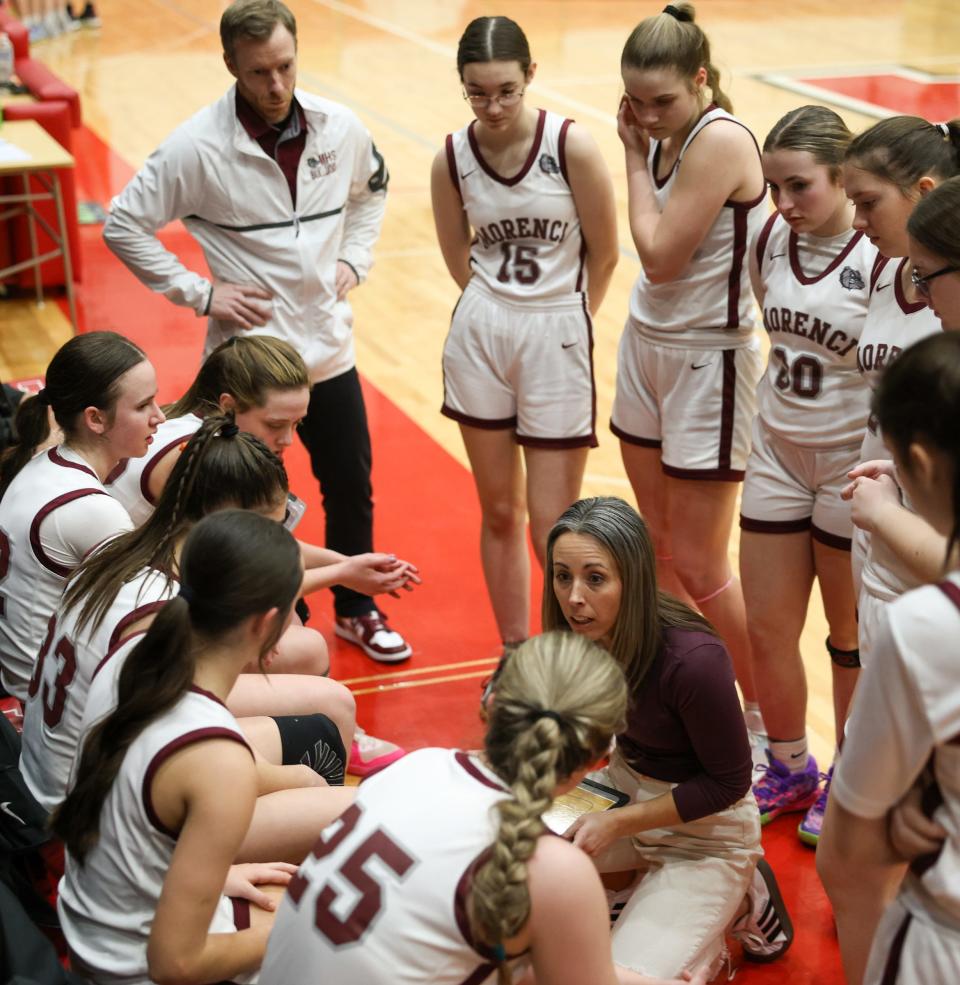 Morenci coach Ashley Joughin gives her team instructions against Summerfield during a 40-16 Morenci win in the semifinals of the Division 4 Regional at Whitmore Lake on Monday, March 11, 2024.