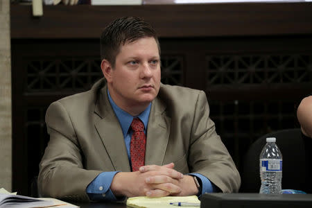 Chicago police Officer Jason Van Dyke watches the prosecution's closing statements during his trial for the shooting death of Laquan McDonald at the Leighton Criminal Court Building in Chicago, Illinois, U.S., October 4, 2018. Antonio Perez/Chicago Tribune/Pool via REUTERS/Files