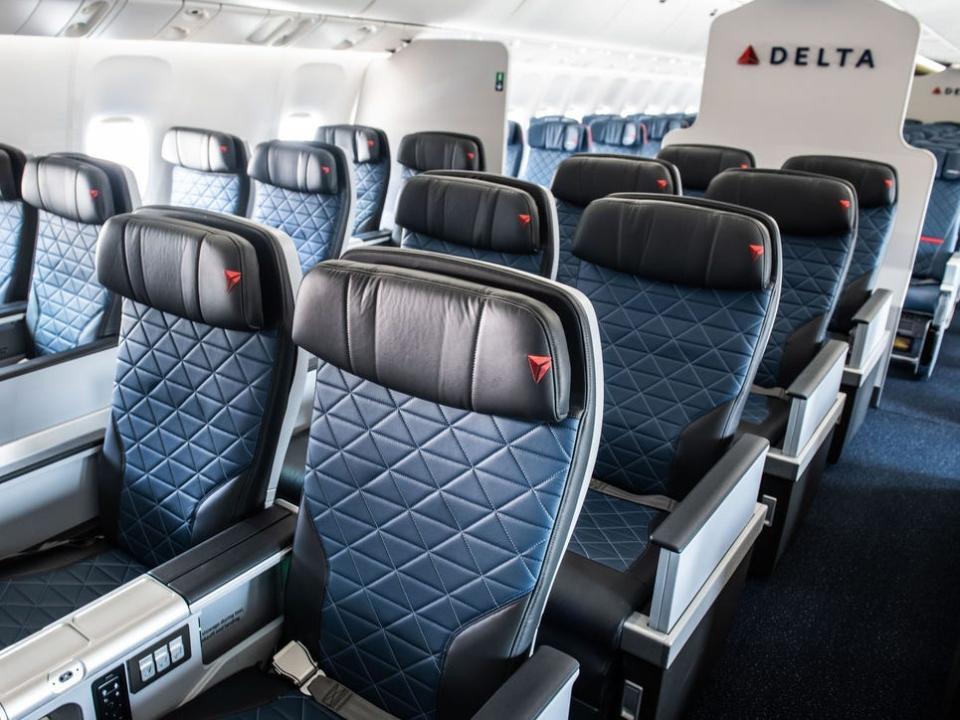 A line of Delta premium select seats.