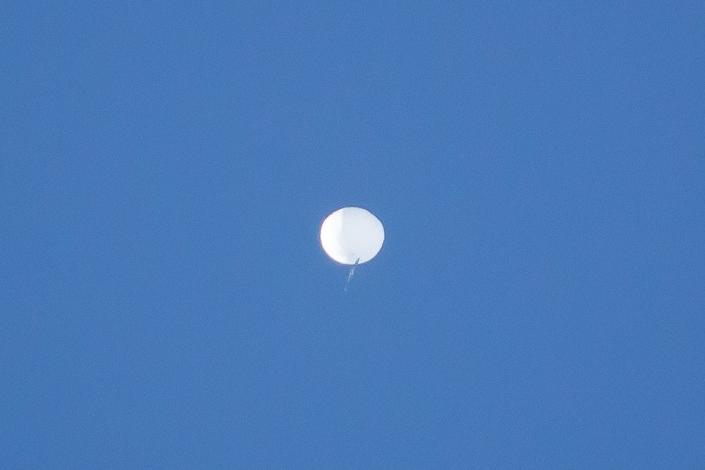 A balloon the U.S. Department of Defense is calling a &quot;high-altitude surveillance balloon&quot; drifts over Western North Carolina in this photo captured by UNC Asheville Meteorology major Evan Fisher and posted to his @EFisherWX Twitter page. The photo was taken in the Fairview area.