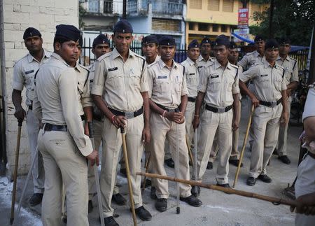 Policemen stand outside Chhattisgarh Institute of Medical Sciences (CIMS) hospital where several women, who underwent a sterilization surgery at a government mass sterilisation "camp", are treated in Bilaspur district, Chhattisgarh, November 13, 2014. REUTERS/Anindito Mukherjee