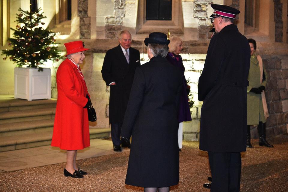 Britain's Queen Elizabeth II (L) stands with Britain's Prince Charles, Prince of Wales (2L), Britain's Camilla, Duchess of Cornwall (3R) and Britain's Princess Anne, Princess Royal, (R) as they thank local volunteers and key workers for the work they are doing during the coronavirus pandemic and over Christmas in the quadrangle of Windsor Castle in Windsor, west of London, on December 8, 2020 - The Queen and members of the royal family gave thanks to local volunteers and key workers for their work in helping others during the coronavirus pandemic and over Christmas at Windsor Castle in what was also the final stop for the Duke and Duchess of Cambridge on their tour of England, Wales and Scotland. (Photo by Glyn KIRK / various sources / AFP) (Photo by GLYN KIRK/AFP via Getty Images)