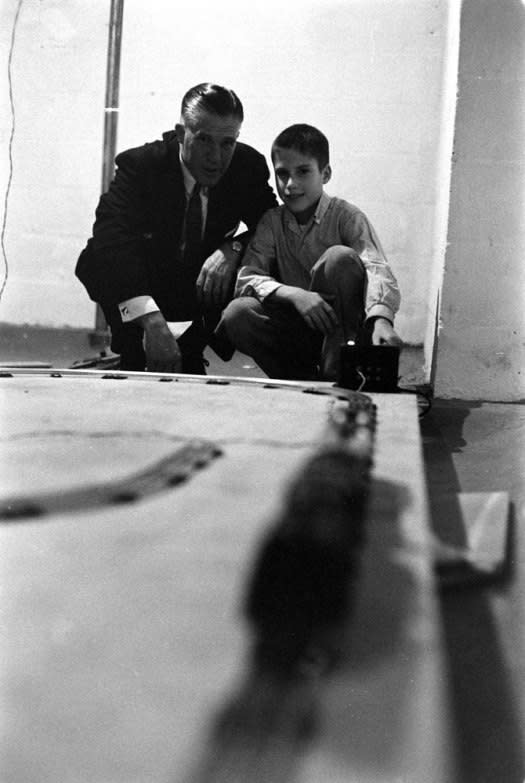 Not originally published in LIFE. George Romney with his son, Mitt, playing with electric trains, 1958. (Grey Villet—Time & Life Pictures/Getty Images) <br> <br> <a href="http://life.time.com/history/mitt-romney-photos-from-the-gop-candidates-early-years/#1" rel="nofollow noopener" target="_blank" data-ylk="slk:Click here to see the full collection at LIFE.com;elm:context_link;itc:0;sec:content-canvas" class="link ">Click here to see the full collection at LIFE.com</a>