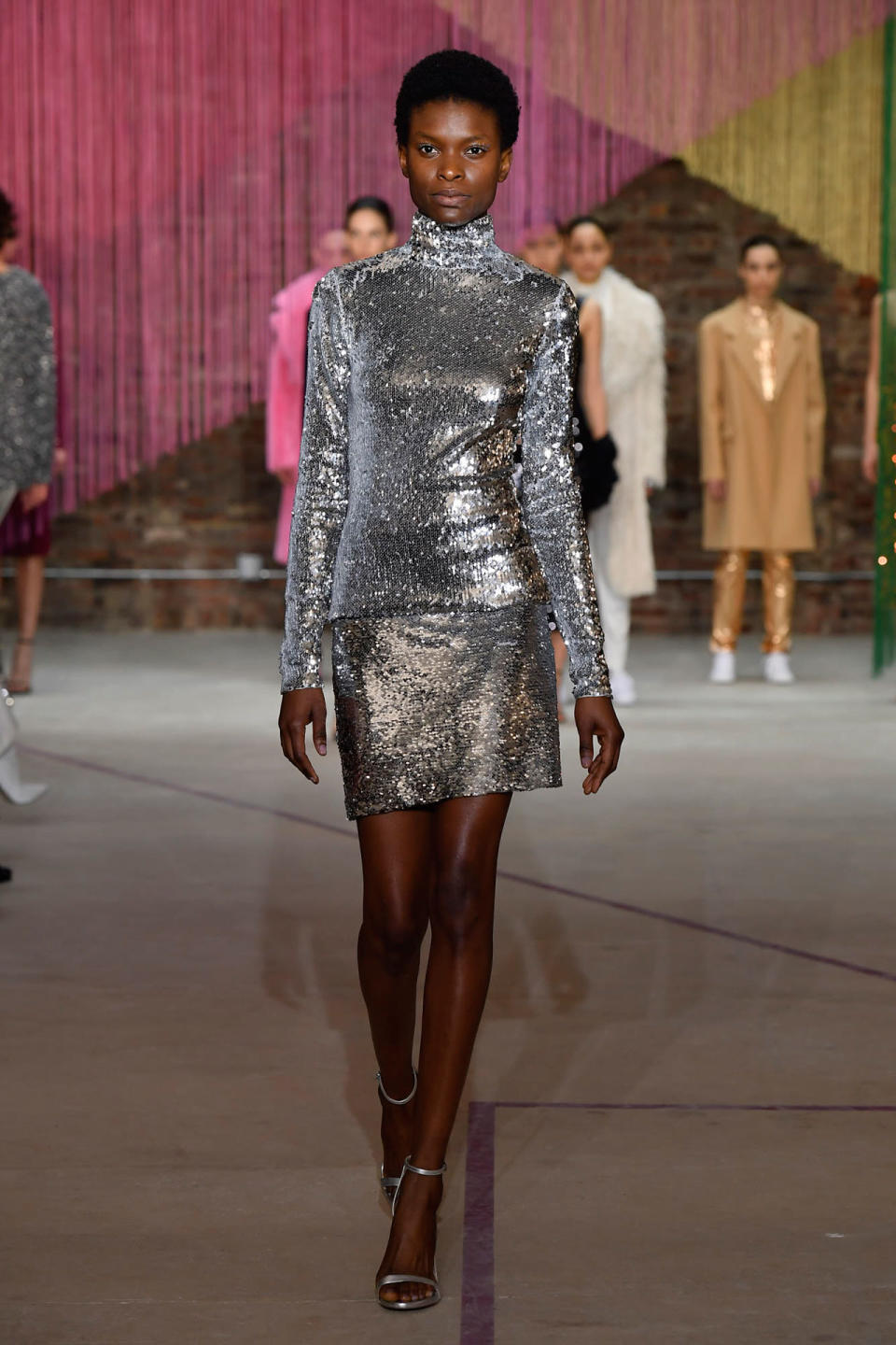 <p>Model wears a metallic sequin top and skirt at the Milly Fall/Winter 2018 show. (Photo: Courtesy of Greg Kessler) </p>