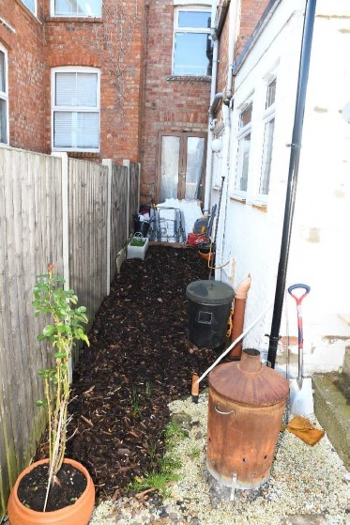 Haunting photos were shown to the court of the garden side return where primary school teacher Fiona Beal buried her partner (Northamptonshire Police)