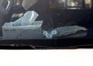 Bullet holes are seen in the window of the vehicle carrying Japanese doctor Tetsu Nakamura after an attack in Jalalabad