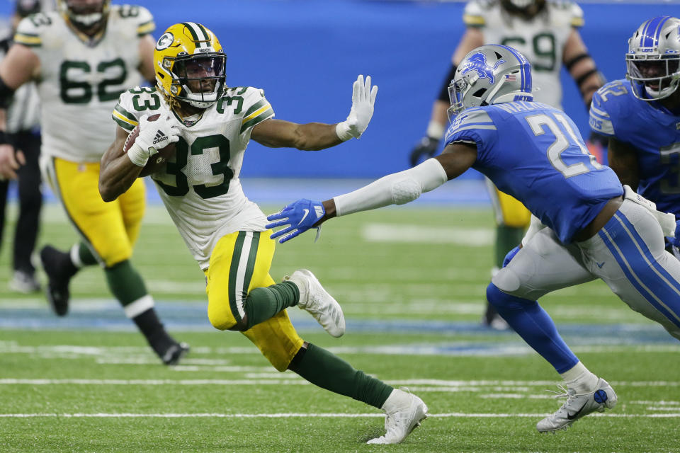 FILE - In this Sunday, Dec. 29, 2019 file photo, Green Bay Packers running back Aaron Jones (33) breaks away from Detroit Lions free safety Tracy Walker (21) during the second half of an NFL football game in Detroit. Jones is one of the league's rising stars. (AP Photo/Duane Burleson, File)