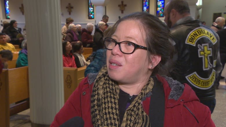 Faithful, curious fill Winnipeg church to view severed forearm of St. Francis Xavier