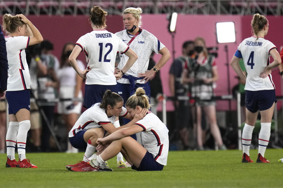 <p>United States' Kelley O'Hara, left, talks to teammate Lindsey Horan after being defeated 1-0 by Canada during a women's semifinal soccer match at the 2020 Summer Olympics, Monday, Aug. 2, 2021, in Kashima, Japan.(AP Photo/Andre Penner)</p> 