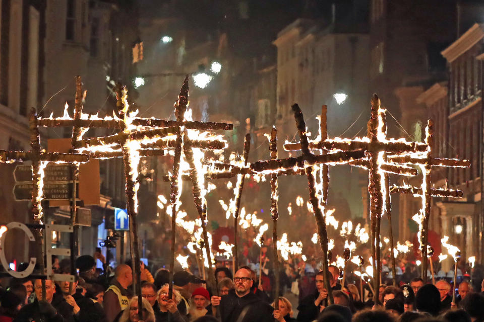 Crosses were lit and held aloft as part of the procession (PA)