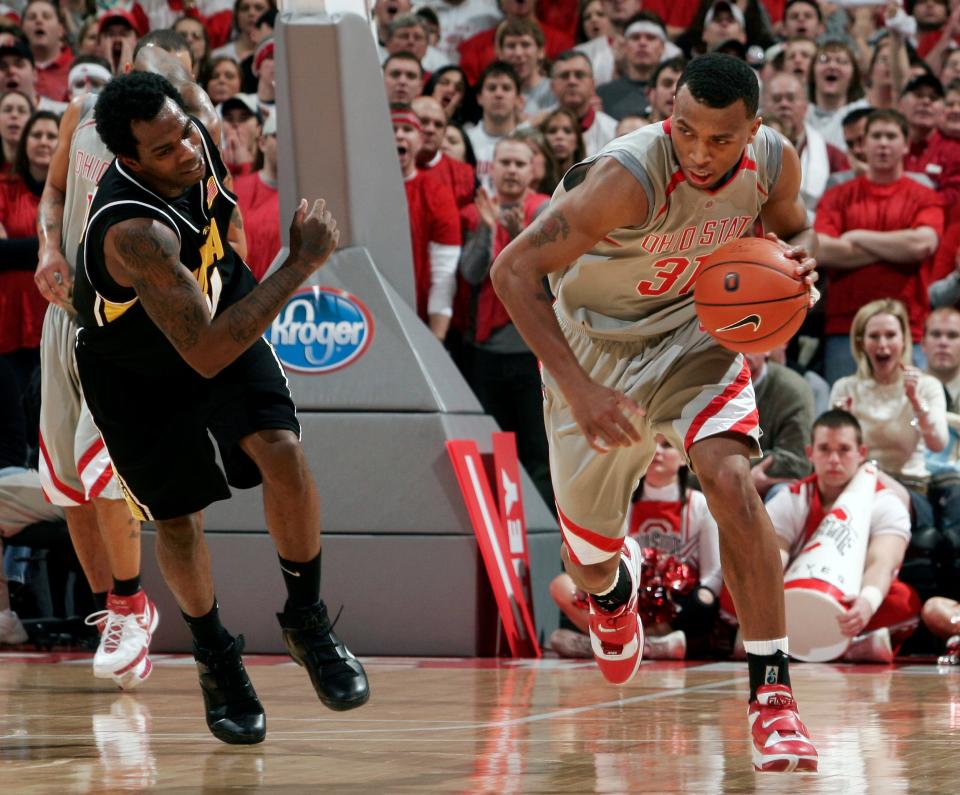 (OSUBBALL21 Robertson Jan 20, 2006) Ohio State's Daequan Cook (cq 31) steals an Iowa pass during the first half at Value City Arena, Saturday, January 20, 2007. (Dispatch photo by Kyle Robertson)