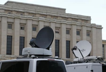 Television vans are pictured ahead of the start of Syrian talks in front of the United Nations European headquarters in Geneva, Switzerland, January 29, 2016. REUTERS/Denis Balibouse