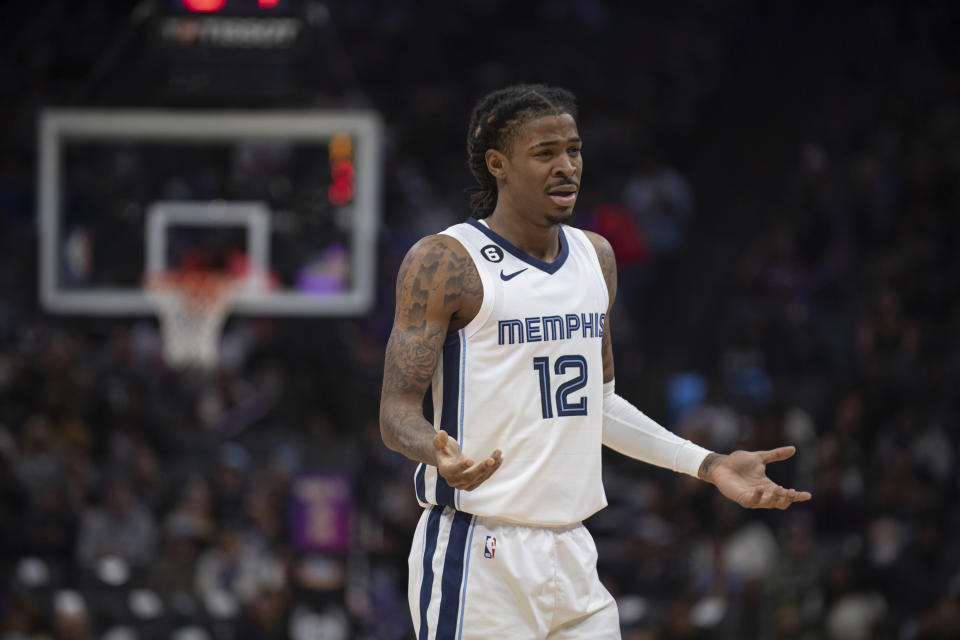 Memphis Grizzlies guard Ja Morant (12) reacts after a foul call in the first quarter of an NBA basketball game against the Sacramento Kings in Sacramento, Calif., Thursday, Oct. 27, 2022. (AP Photo/José Luis Villegas)