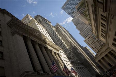 American flags hang in front of the New York Stock Exchange in the financial district May 2, 2014. REUTERS/Brendan McDermid