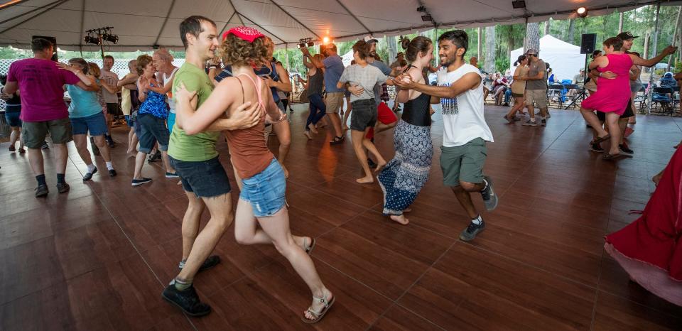 The Family Contra Dance on the Heritage Stage with music by Jackson Creek and the call by Andy Kane, during the 2017 Florida Folk Festival at Stephen Foster State Park in White Springs.