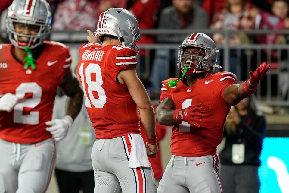 Sep 7, 2024; Columbus, Ohio, USA; Ohio State Buckeyes running back Quinshon Judkins (1) celebrates scoring a touchdown with quarterback Will Howard (18) during the first half of the NCAA football game at Ohio Stadium.