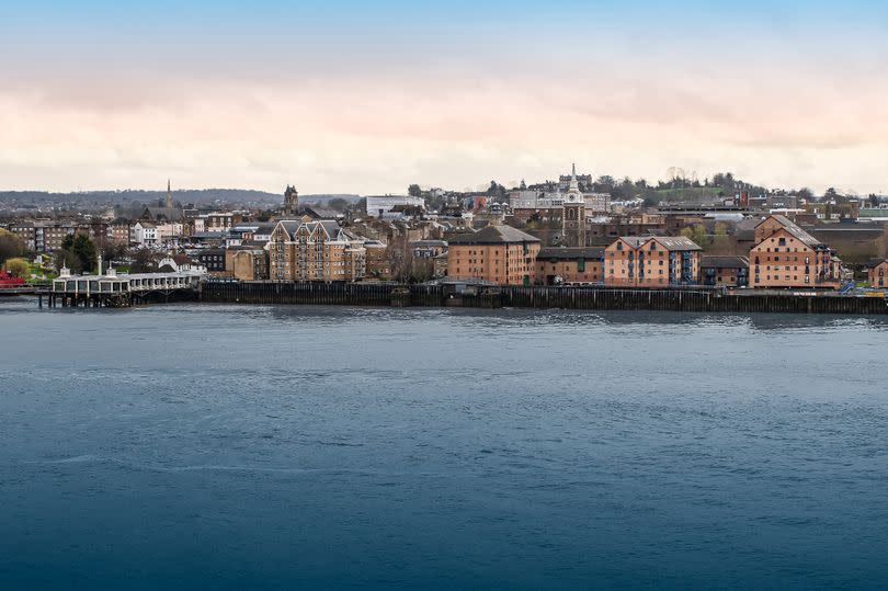 Wide landscape image of Gravesend city skyline at the river across the cruise terminal in Tilbury England, United Kingdom.