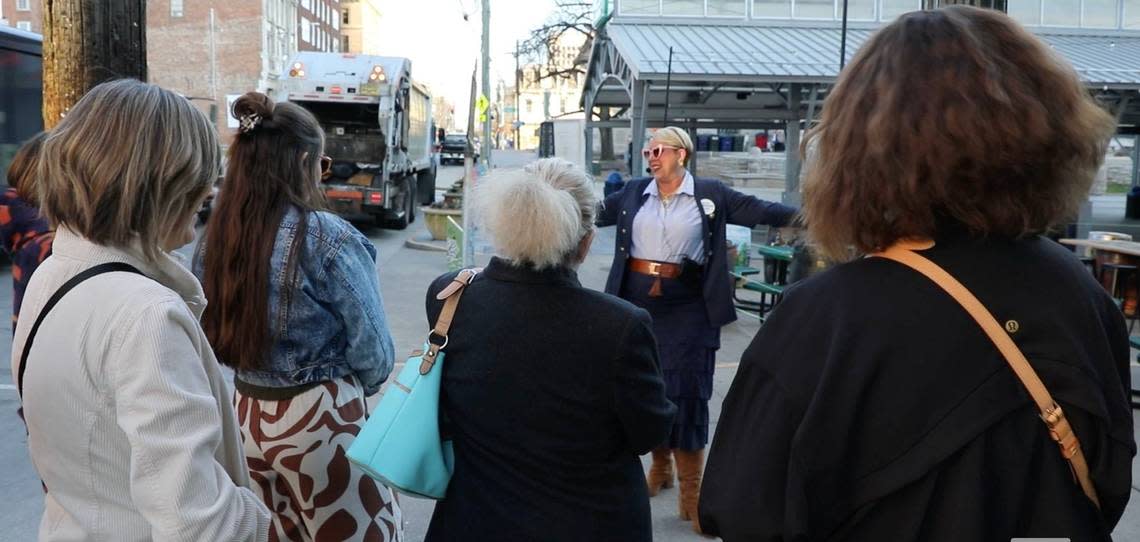 Owner and tour guide of the Bites of the Bluegrass tours, Erin Goins, gives participants a walking food and history tour of downtown Lexington, Ky, on Thursday, March 21, 2024.