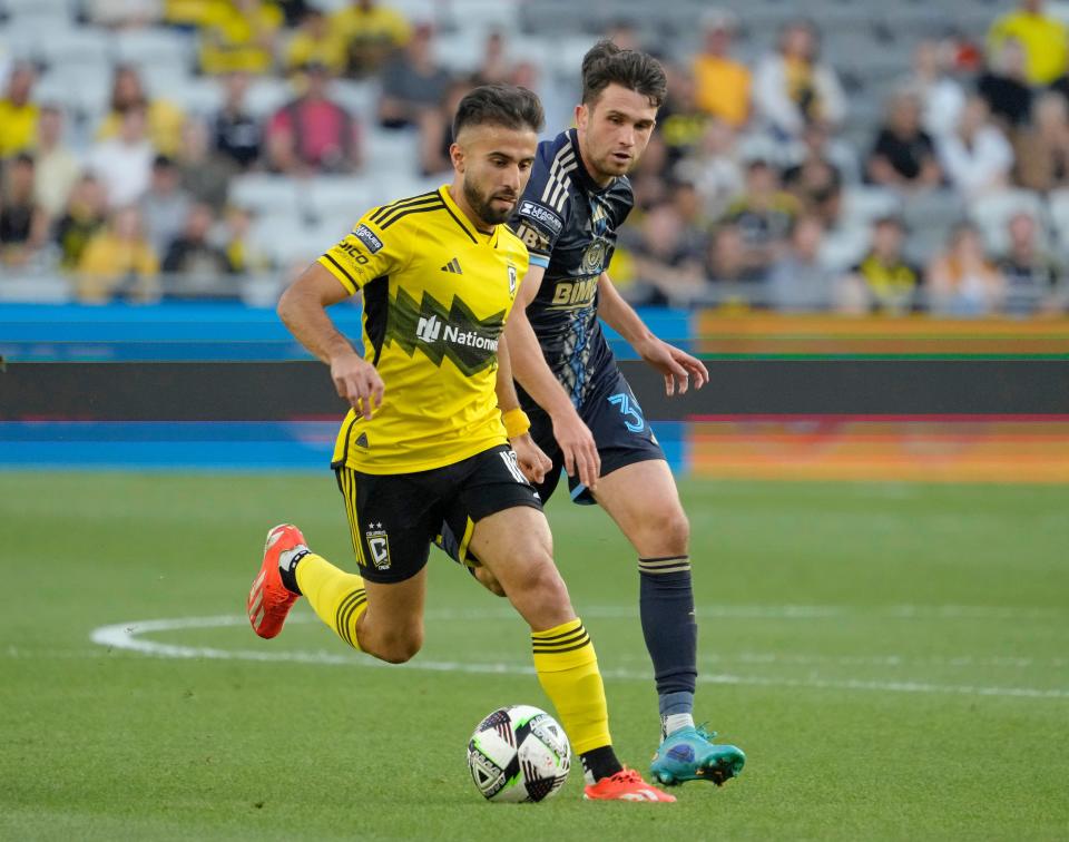 August 21, 2024; Columbus, Ohio, USA; 
Columbus Crew forward Diego Rossi (10) is defended by Philadelphia Union midfielder Leon Flach (31) during a semifinal Leagues Cup match at Lower.com Field.