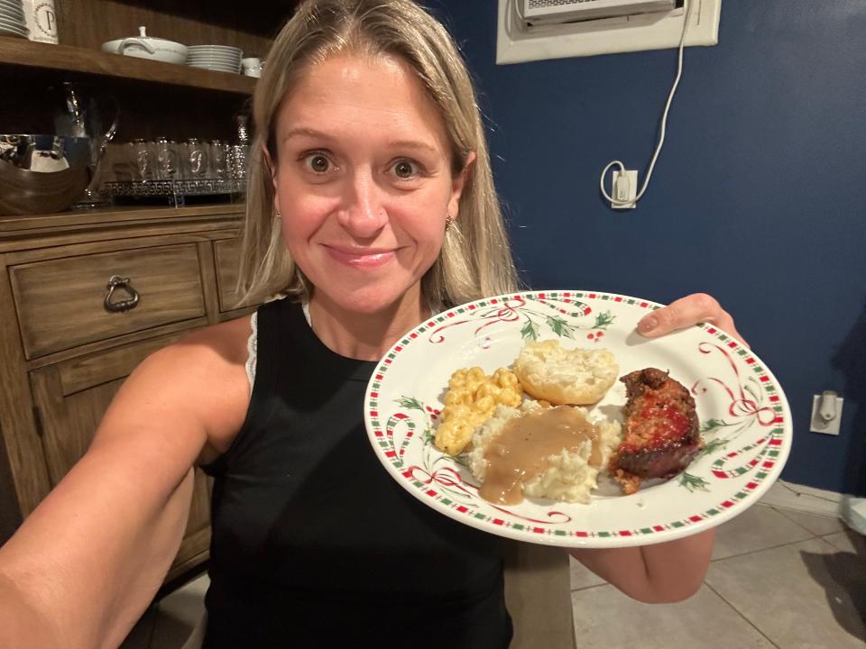 Author Terri Peters holding plate of food 