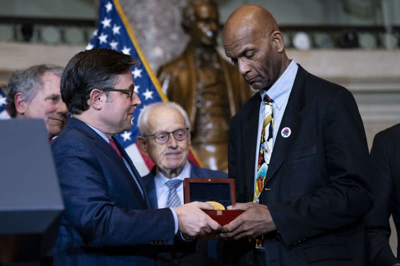 Speaker of the House Mike Johnson, R-La.,, awards the Congressional Gold Medal to Larry Doby Jr., in honor of his father Major League Baseball player and civil rights activist Larry Doby. Doby, who was the first African American to play in the American league, was posthumously awarded the medal during a ceremony Wednesday at the U.S. Capitol in Washington, D.C. Photo by Bonnie Cash/UPI