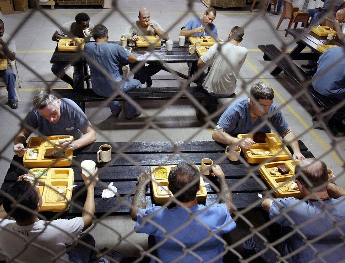 Florida inmates take a lunch break during their work shift.
