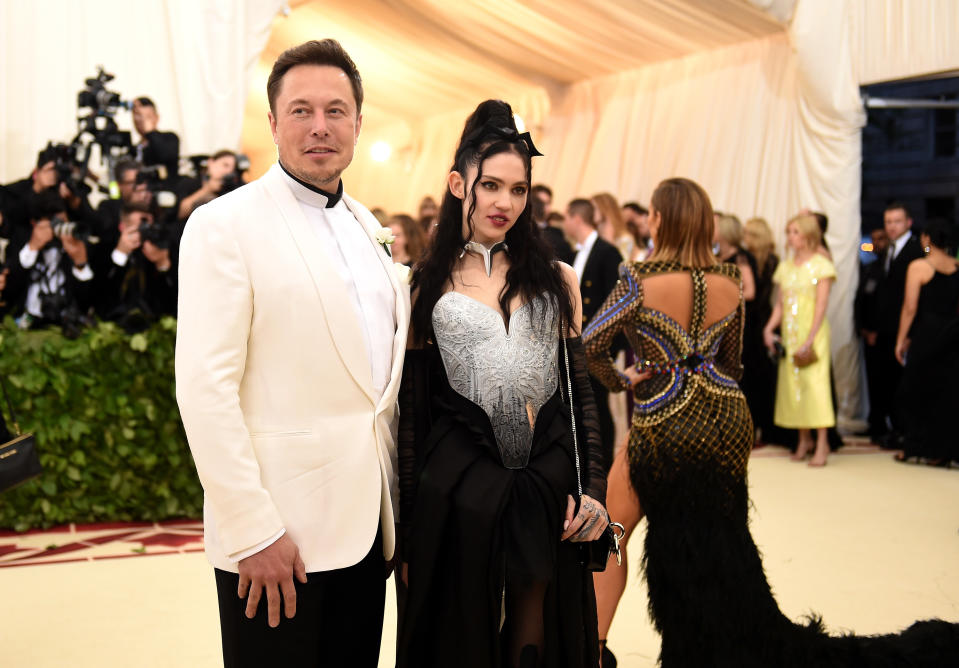 NEW YORK, NY - MAY 07:  Elon Musk and Grimes attend the Heavenly Bodies: Fashion & The Catholic Imagination Costume Institute Gala at The Metropolitan Museum of Art on May 7, 2018 in New York City.  (Photo by Jason Kempin/Getty Images)