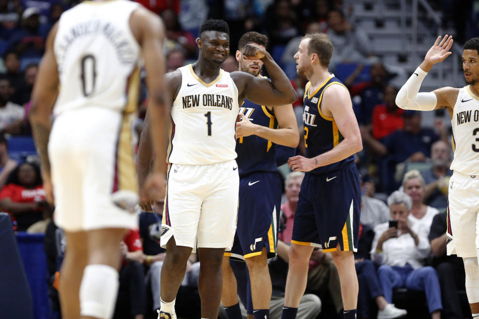 New Orleans Pelicans forward Zion Williamson (1) reacts after scoring a basket against the Utah Jazz during the second half of a preseason NBA basketball game in New Orleans, Friday, Oct. 11, 2019. The Pelicans won 128-127. (AP Photo/Tyler Kaufman)