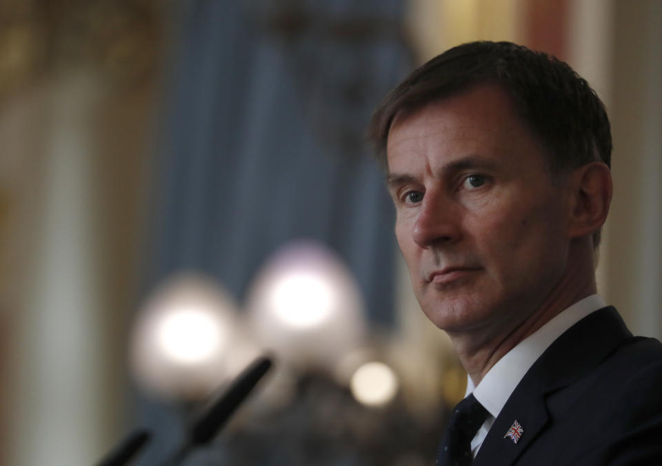 FILE - Britain's Foreign Secretary Jeremy Hunt, listens to a question during a press conference with the Bishop of Truro Philip Mounstephen about the Bishop's final report into the Foreign Office's support for Persecuted Christians around the world, in London, Monday, July 8, 2019. British Prime Minister Boris Johnson managed to see off a no-confidence vote from his own Conservative Party — but the result dealt a heavy blow to his authority, and questions are already being asked over who could succeed him. (AP Photo/Alastair Grant, Pool, File)