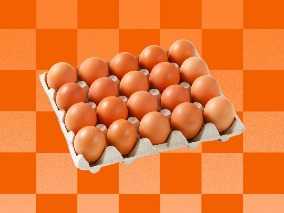 Carton of eggs on an orange checkered background
