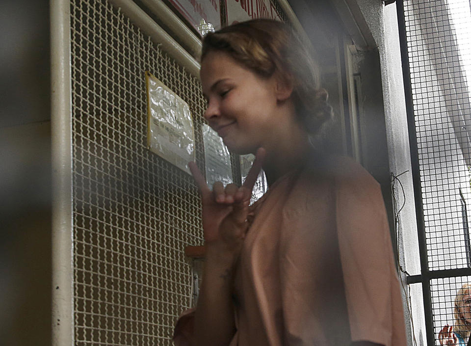 Anastasia Vashukevich, arrives at the Pattaya Provincial Court in Chonburi province, Thailand, Monday, Aug. 20, 2018. Vashukevich, from Belarus, who claimed to have information linking Russian interference to the election of President Donald Trump says she no longer has the evidence and will not talk about it. On Monday she pleaded innocent as her trial in Thailand began on charges of soliciting and conspiracy to solicit. (AP Photo/Sakchai Lalit)