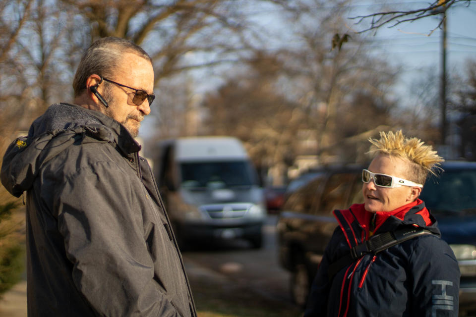 Dawn Baldwin, right, and Bill Miller, Baldwin's former case manager, talking outside of the Lafayette Transitional Housing Center Eighth Street Commons on Tuesday, Dec. 21, 2021, at 815 N 12th Street, in Lafayette, Ind.