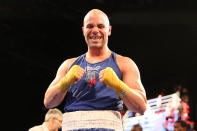 <p>Mark “Muscle Shark” Sinatra shows off a mouthpiece smile following his victory in the Super Heavy Champ class of the NYPD Boxing Championships at the Theater at Madison Square Garden on June 8, 2017. (Photo: Gordon Donovan/Yahoo News) </p>