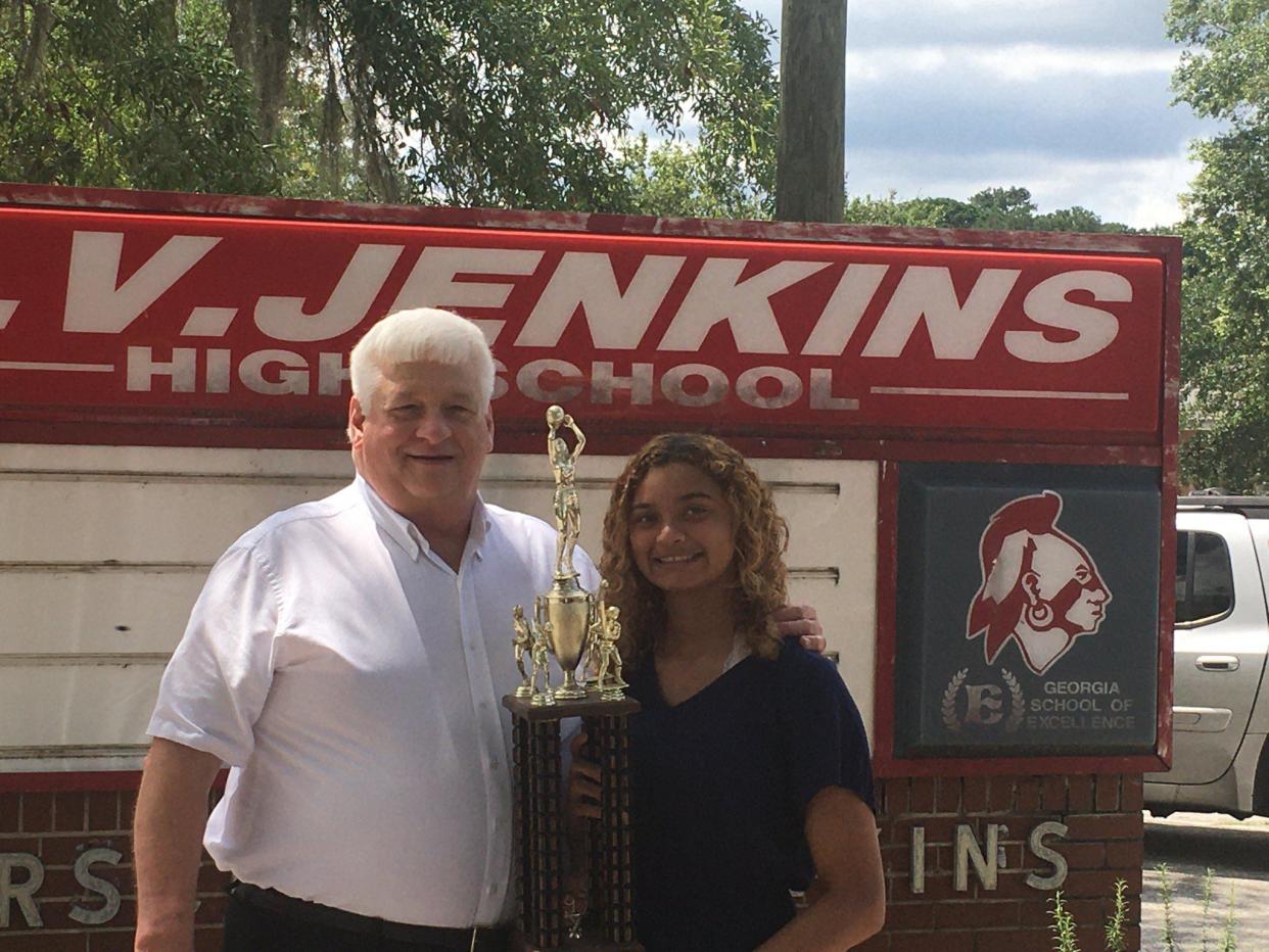 BryAnn Pound of Jenkins High School receives the Hollis Stacy Award from Gary Moses on June 14 2020 at Jenkins.