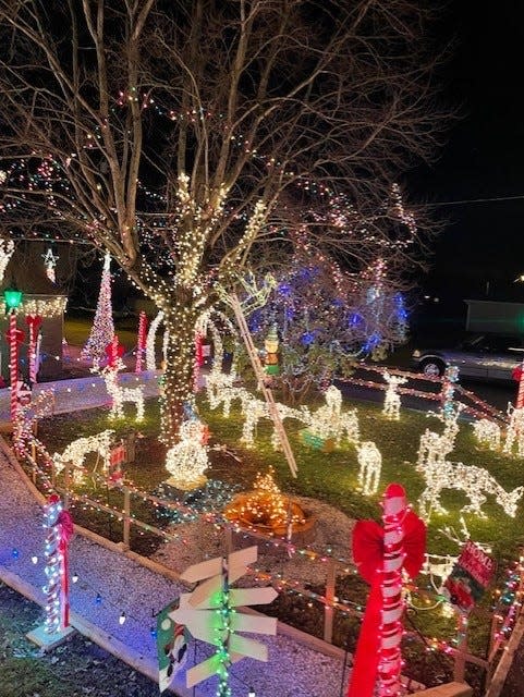 The Scott family at 310 E. Carrollton St. in Magnolia has created a hand-built display with more than 200,000 lights that includes a 34-foot star and a cardinal with an 8-foot wingspan.