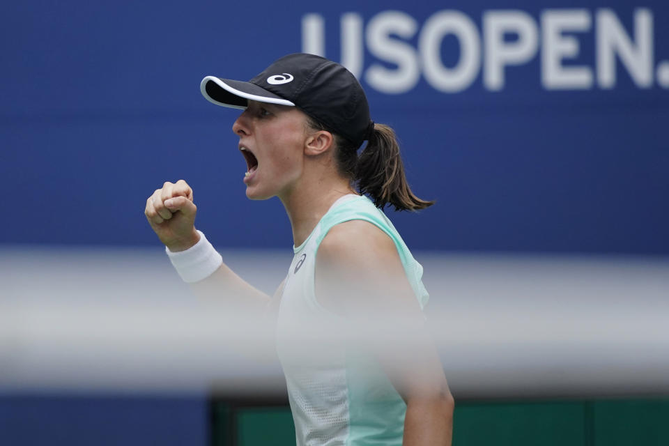 Iga Swiatek, of Poland, celebrates after defeating Jule Niemeier, of Germany, during the fourth round of the U.S. Open tennis championships, Monday, Sept. 5, 2022, in New York. (AP Photo/Eduardo Munoz Alvarez)