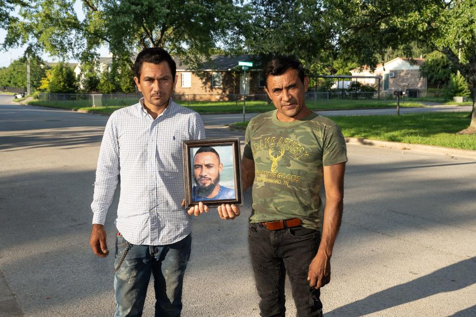 Jose Reanos-Mendoza died in an inmate fight in July 2021 while serving 30-day sentence at the Rutherford County Adult Detention Center. His two brothers, Jose Jonathan Reanos-Mendoza, left, and Adan Cruz, right, poses with photo of their brother outside their Murfreesboro home on Wednesday, Aug. 16, 2023. Cruz remembers that Jose expressed concerns about his safety in the jail during a phone call on the day of the attack. "He needed protection," Cruz says.