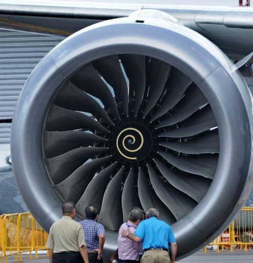 Visitors are seen next to an engine of a Boeing 787 Dreamliner, displayed at the Singapore Airshow, on February 12. Boeing said around 55 of its flagship 787 Dreamliners "have the potential" to develop a fuselage shimming problem, but reiterated that the fault was being fixed