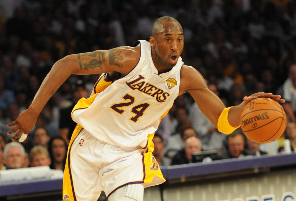 Kobe Bryant in the white Lakers jersey. 