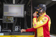 Ryan Hunter-Reay looks over data during practice for the Indianapolis 500 auto race at Indianapolis Motor Speedway in Indianapolis, Friday, Aug. 14, 2020. (AP Photo/Michael Conroy)