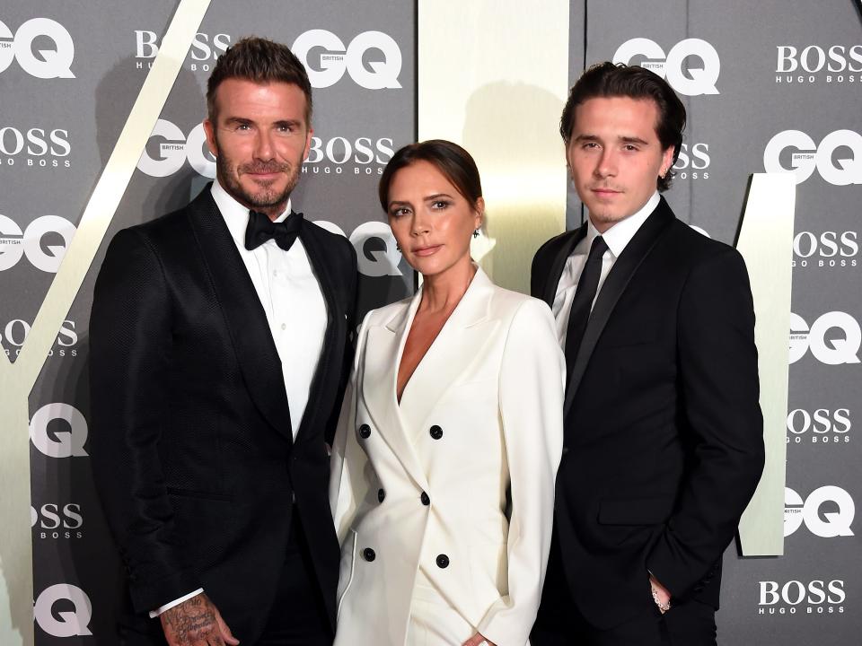 David, Victoria, and Brooklyn Beckham in 2019.